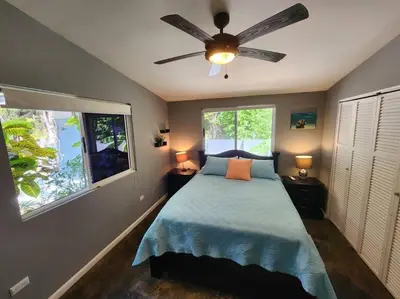 a bedroom with a bed and a ceiling fan at #17A Hermosa Beach Bungalow 1st floor 1 bedroom Apt in Playa Hermosa