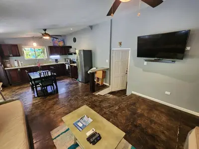 a living room with a flat screen tv on the wall at #17A Hermosa Beach Bungalow 1st floor 1 bedroom Apt in Playa Hermosa
