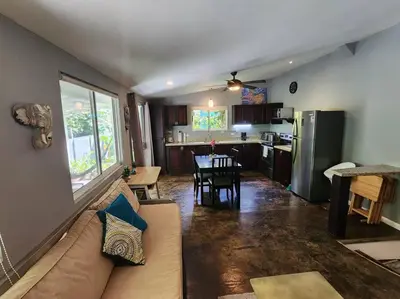 a living room with a couch and a table and a kitchen at #17A Hermosa Beach Bungalow 1st floor 1 bedroom Apt in Playa Hermosa