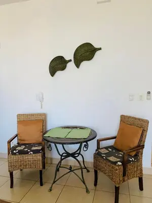 two chairs and a table in a room at A5 PL Near the beach 1bed 1 office 1 bathroom in Tamarindo