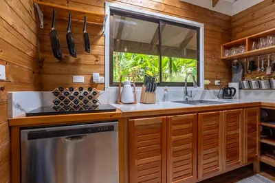 a kitchen with a sink and a window at Casa Serena - Tranquil Jungle Gem Near the Beach in Uvita