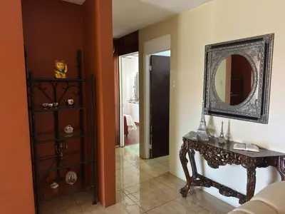 a room with a table and a mirror on the wall at Aurora Retreat Costa Rica in Tilarán