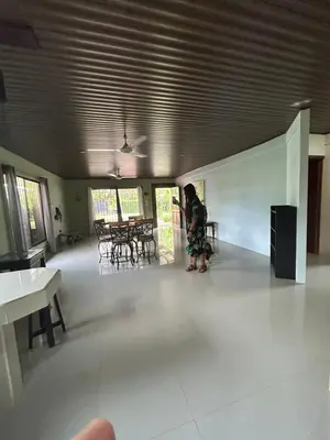 a woman standing in the middle of a room at Casita Verde in Uvita
