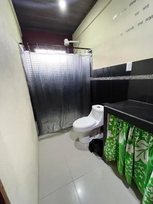 a bathroom with a toilet and a shower at Casita Verde in Uvita