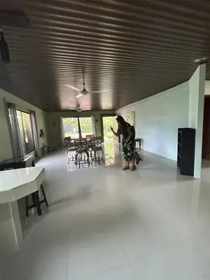 a person is standing in a room with a table at Casita Verde in Uvita