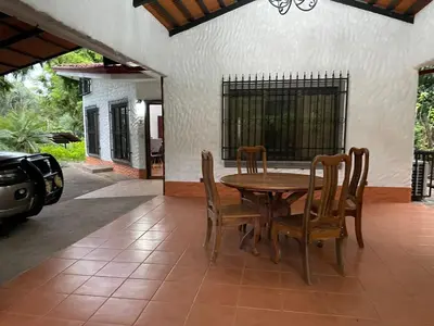 a dining room with a table and chairs at Villa Lagunillas in Lagunillas