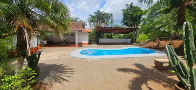 a swimming pool in the middle of a yard at Villa Lagunillas in Lagunillas