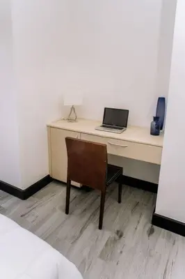 a desk with a laptop computer on top of it at Spacious and Modern Penthouse Condo in Jacó
