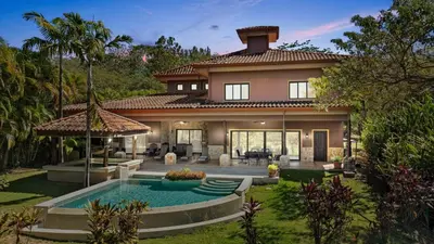 a house with a swimming pool in the yard at Casa Paulina in Playa Conchal