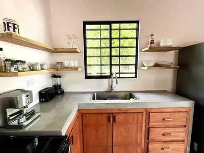 a kitchen with a sink and a window at 3 Bdr Villa With Pool , Near beach, Fast Wifi in Veintisiete de Abril