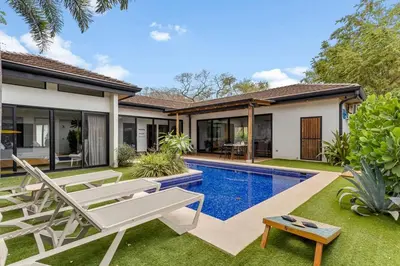 an image of a villa with a swimming pool at CU15 New Modern Home with Casitas and Private Pool in Tamarindo