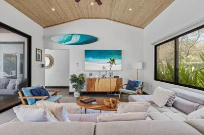 a living room with a couch and a table at CU15 New Modern Home with Casitas and Private Pool in Tamarindo