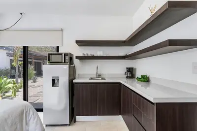 a kitchen with a sink and a refrigerator at CU19 New 3 Bdrm Mod Home with Casita Prv Pool in Villarreal