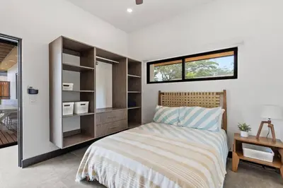 a bedroom with a large bed and a window at CU20 Modern Beach Home w Guest House & Pvt Pool in Villarreal