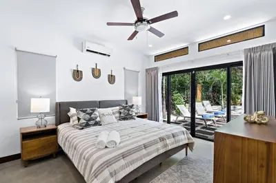 a bedroom with a bed and a ceiling fan at CU27 New Construction 3bdrm Home with Prv Pool in Tamarindo