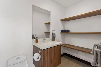 a bathroom with a sink and a toilet at CU7 Beach Home Oasis with Private Pool and Guest House in Barco Quebrado