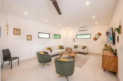 a living room with a couch and chairs and a table at Modern New Villa in Playa Potrero Close to Beach in Potrero