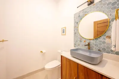 a bathroom with a sink and a mirror at Modern New Villa in Playa Potrero Close to Beach in Potrero