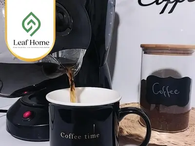 a coffee maker pouring coffee into a coffee cup at Alajuela Leaf Home in Alajuela City