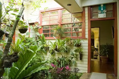 a house with plants on the side of it at Hotel Aranjuez in San José