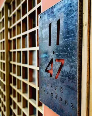 a sign on the side of a building with at Hotel Aranjuez in San José