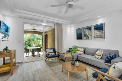 a living room with a couch and a table at Gav4 New Condo in Location Walkable to Beach in Tamarindo