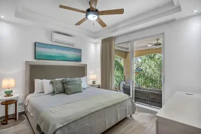 a bedroom with a bed and a ceiling fan at Gav4 New Condo in Location Walkable to Beach in Tamarindo