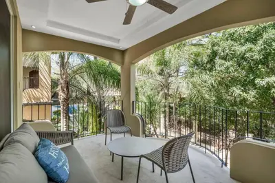 a patio with a couch and chairs and a table at Gav4 New Condo in Location Walkable to Beach in Tamarindo