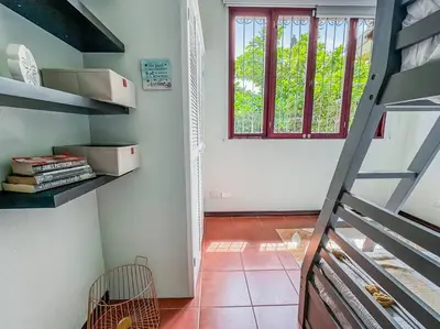 a room with a ladder and a window and a staircase at LSI1 Cozy 2 Bdrm Villa Central and Steps to Beach in Tamarindo