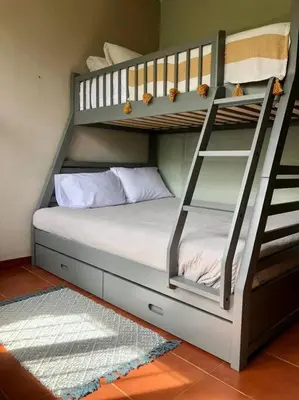 a bedroom with a bunk bed with a ladder at LSI1 Cozy 2 Bdrm Villa Central and Steps to Beach in Tamarindo