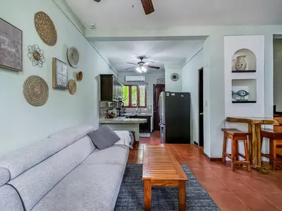 a living room with a couch and a table at LSI1 Cozy 2 Bdrm Villa Central and Steps to Beach in Tamarindo