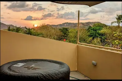 a large tire sitting on the side of a balcony at Matambú Main House in Cuajiniquil