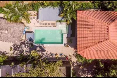 an overhead view of a house with a swimming pool at Matambú Ranchita Charming & Rustic with Shared Pool in Matapalo