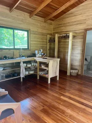 a wooden room with a desk and a wooden floor at Almond Suite - Blue Zone Costa Rica, Hojancha in Caimital