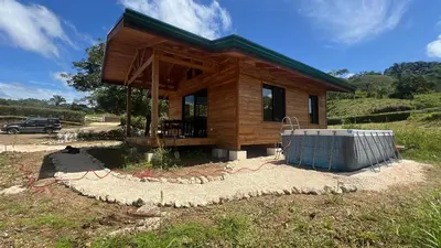a small house is being built in a field at Almond Suite - Blue Zone Costa Rica, Hojancha in Caimital