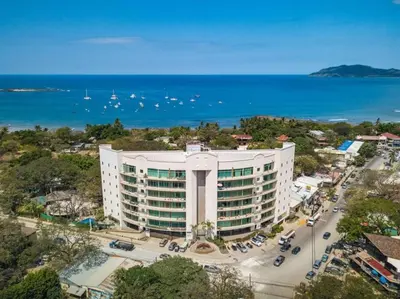 an aerial view of a large white building next to the ocean at PP201 Modern Space in Centre of Town in Tamarindo