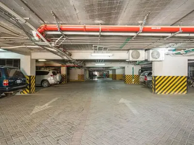 an empty parking garage with cars parked in it at PP201 Modern Space in Centre of Town in Tamarindo