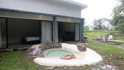 a house with a swimming pool in the yard at Holly House La Fortuna in Agua Azul