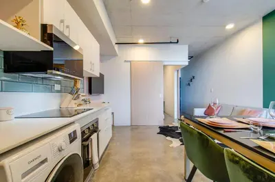 a kitchen with a counter with a dishwasher at Nice&Cozy Loft URBN Escalante in San José