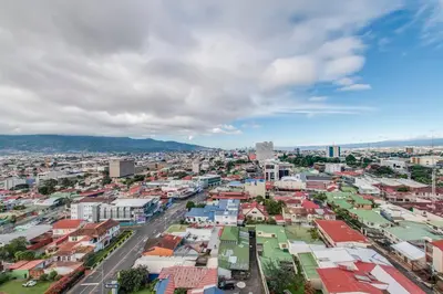 an aerial view of a city with buildings at Nice&Cozy Loft URBN Escalante in San José