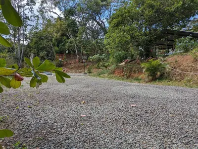 a gravel road with a house in the background at Fully furnished lodge with hot tub and pool - Alto Castillo in San José
