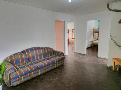 a living room with a couch and a table at Haven Hotel in San José