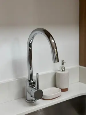 a kitchen sink with two faucets on a counter at Condo Apt 3BR,2BA, 4mi from SJO Airport, Pool,Gated, Gym in Desamparados