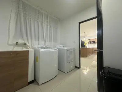 two washing machines in a bathroom with a mirror at Condo Apt 3BR,2BA, 4mi from SJO Airport, Pool,Gated, Gym in Desamparados