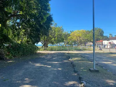 a street with a pole on the side of the road at Tropical Camas Surf House in Pochotal
