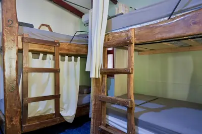 a couple of bunk beds in a room at Tropical Camas Surf House in Pochotal