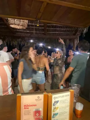 a group of people dancing in a party at Tropical Camas Surf House in Pochotal