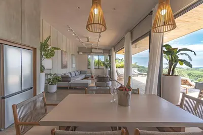 a dining room with a table and chairs at Blanko Mar Ocean view in Santa Teresa Beach