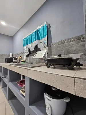 a kitchen with a counter with a sink and a counter at Villas Atardecer Tamarindo in Santa Rosa