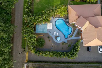 an overhead view of a house with a swimming pool at Arenal Family Home - Families & Friends Gateway in Fortuna